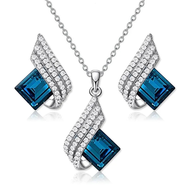 Women's alloy pendant and glass necklace with matching electroplated ear studs in cross chain style.