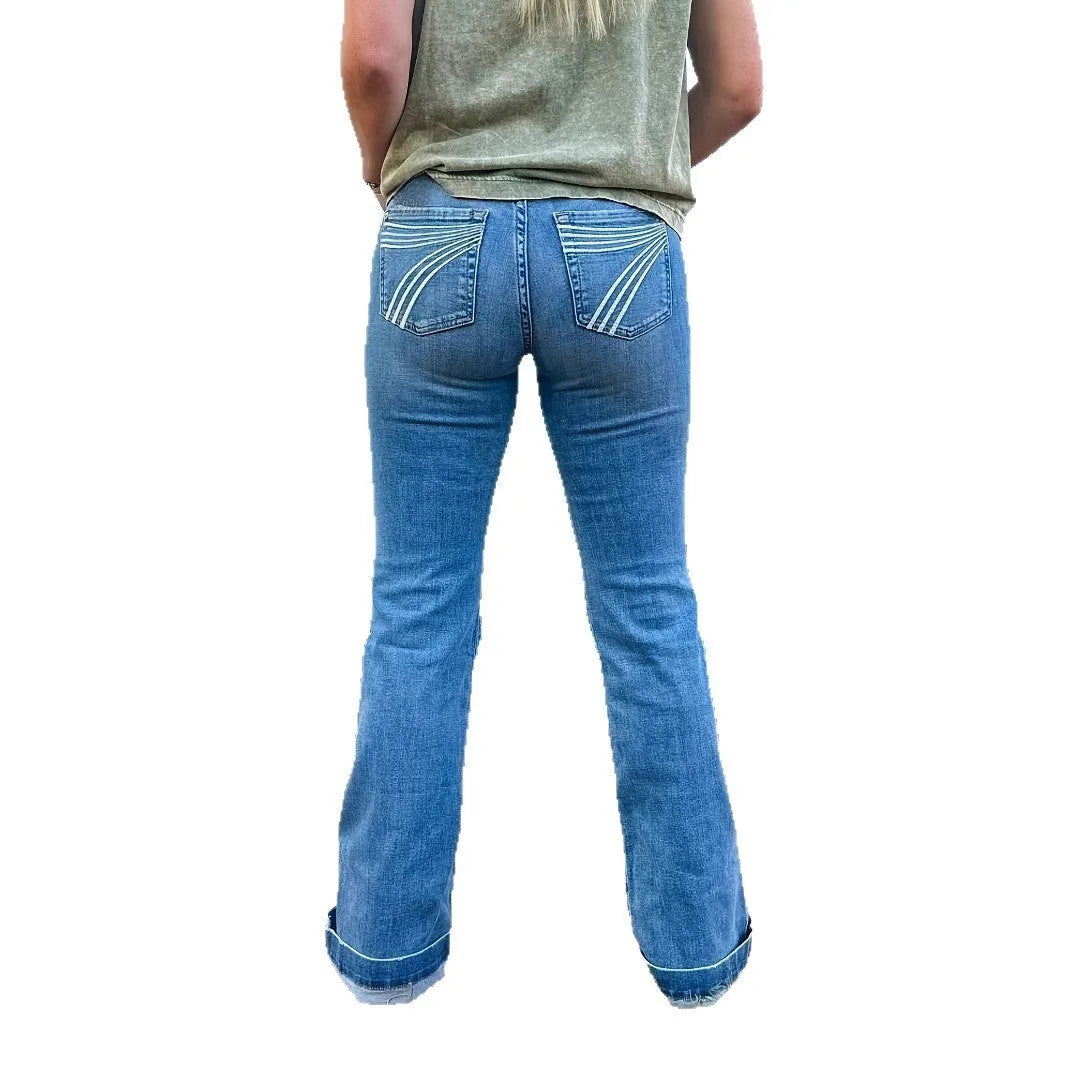 Slim fit elastic mid-waist slightly flared jeans with embroidery detailing on blue denim