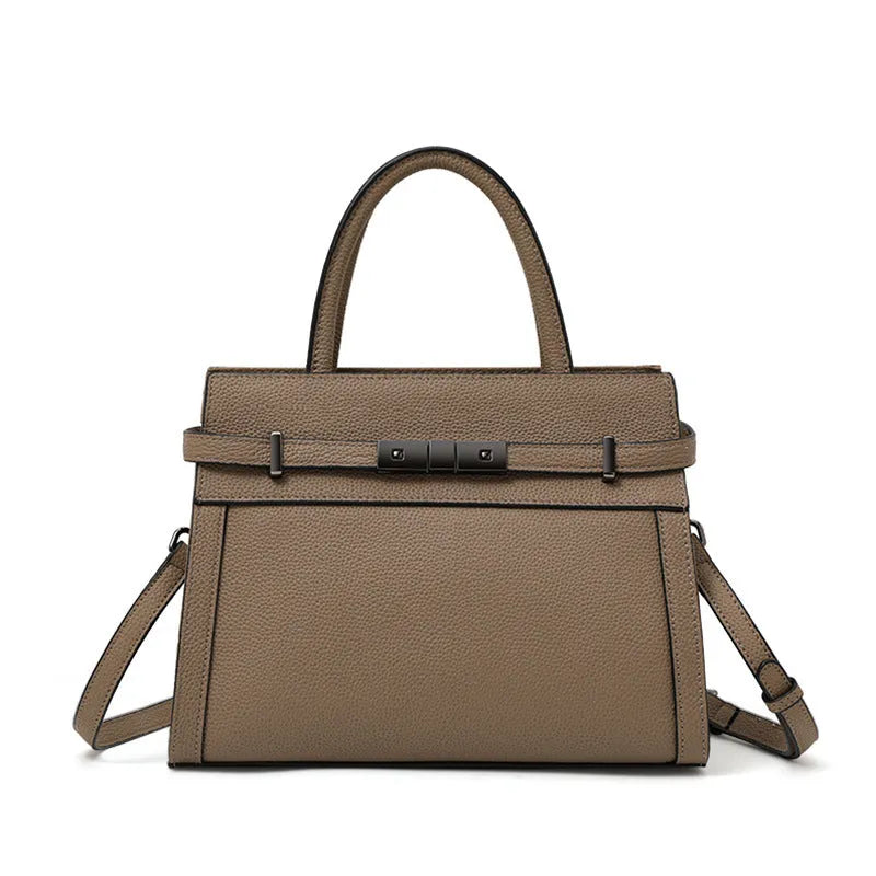 Women's square genuine leather crossbody handbag in clamshell style with internal compartments.