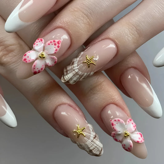 Set of floral French tip false nails with grey rock pattern accents on a simple pink base.