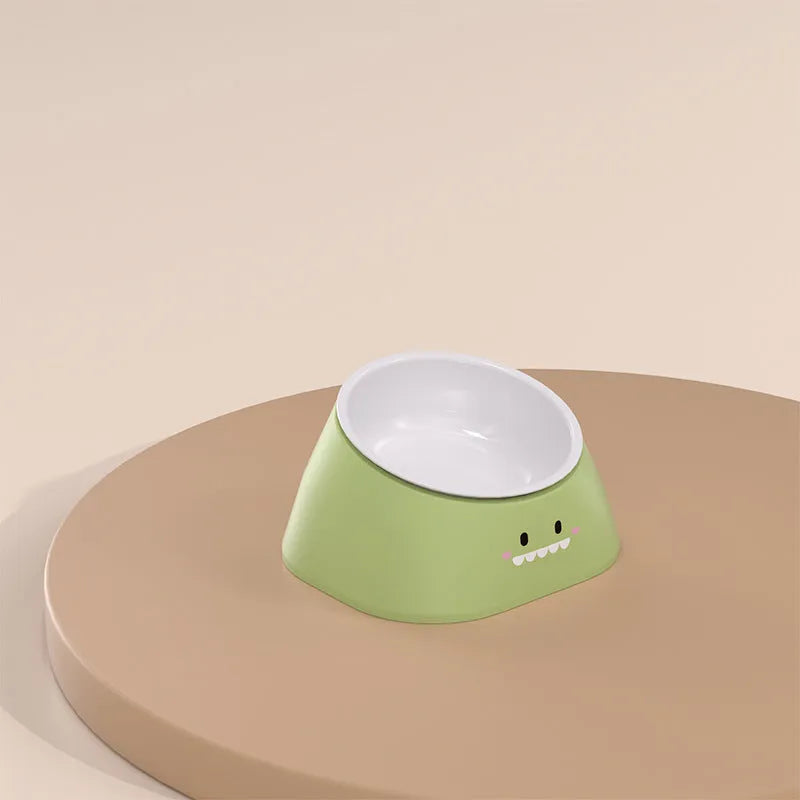 Green tilted stainless steel pet bowl with a 15-degree angle on a white background.