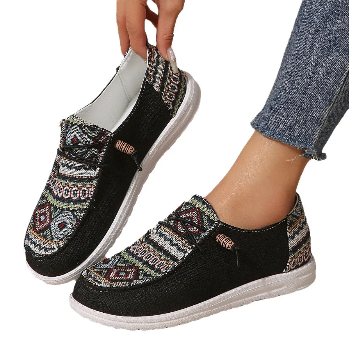 Women's black round toe flat shoes with low-top design and elasticated oversleeves