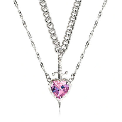 Fashionable Heart and Sword Pendant Necklace Set made of stainless steel with sparkling crystals for a bold, romantic look