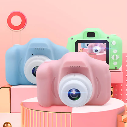 Colourful kids digital camera with silicone case showing 2-inch screen and lens.