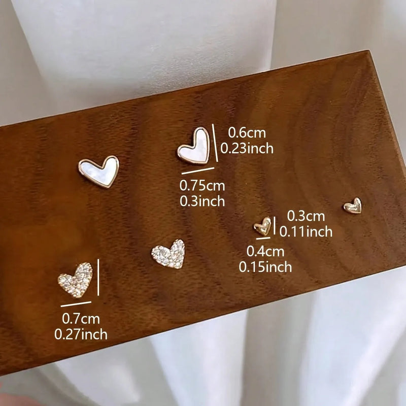 Fashion All-match Love Sweet Girly Earrings Suit: 3-pair set with gold, black, black and white, and pink electroplated alloy heart-shaped designs for versatile daily wear