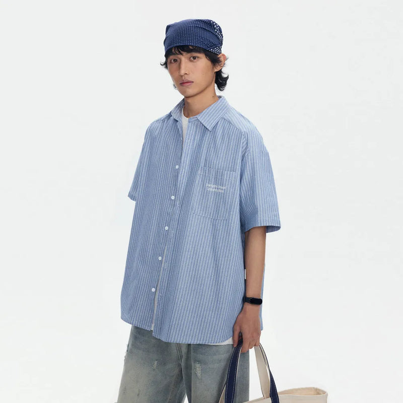 Striped overalls shirt in a short-sleeved, loose cardigan style for men and women, crafted from a cotton blend fabric, available in blue with a casual stripe pattern, offered in sizes M, L, XL, and XXL for youth and leisure wear.