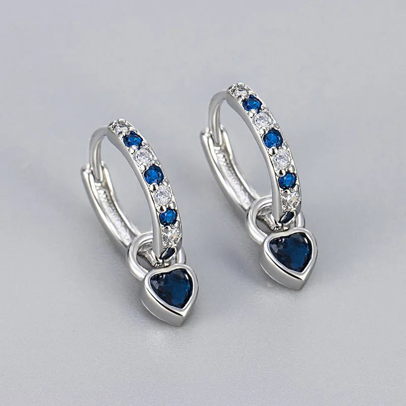 Fashion zircon earrings with 10mm heart-shaped drops in gold and white gold settings, showing diamond-treated stones