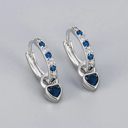 Fashion zircon earrings with 10mm heart-shaped drops in gold and white gold settings, showing diamond-treated stones