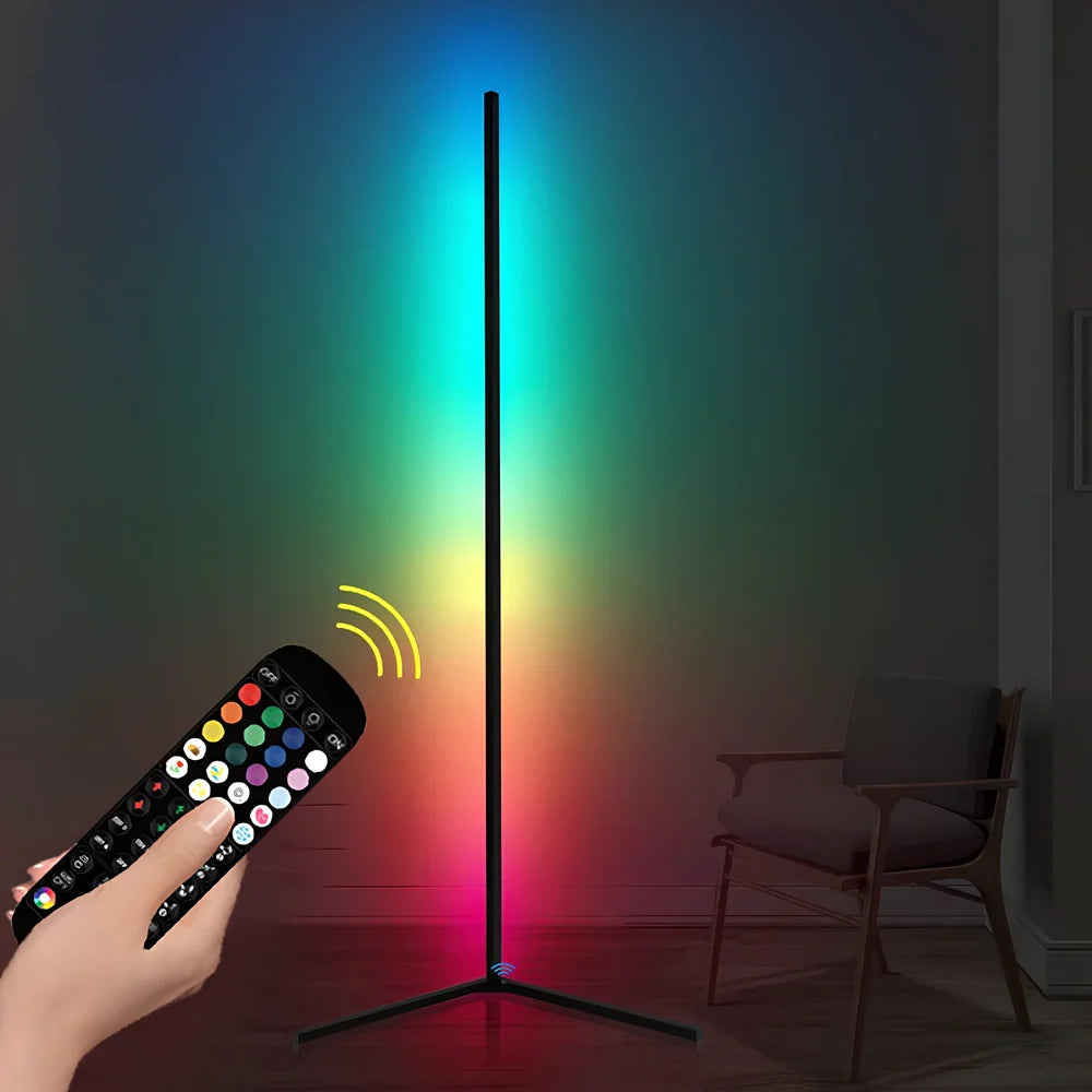 Black smart RGB floor lamp with remote control showing colour-changing illumination in bedroom setting