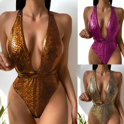 Solid colour one-piece swimsuit for women shown in gold, with a classic design and lined interior.