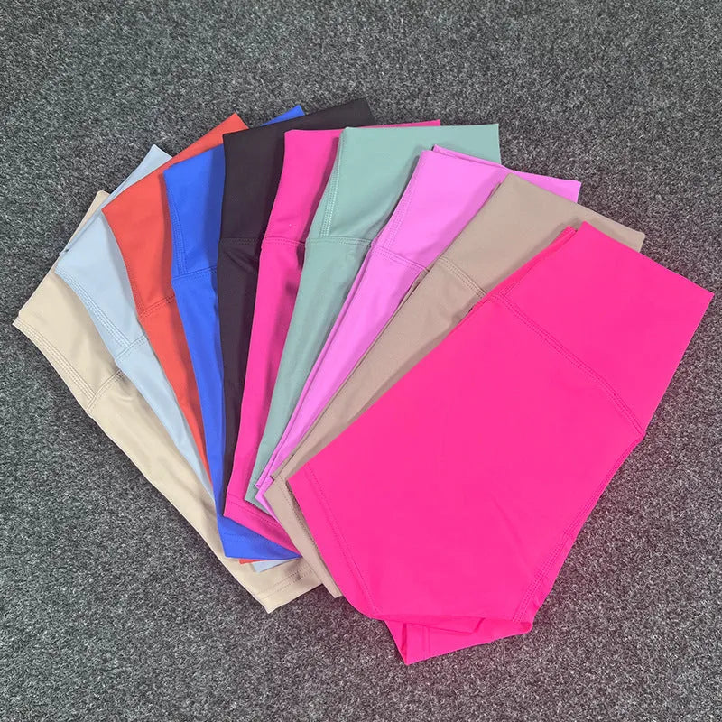 High-waisted yoga shorts in nylon fabric for moisture-wicking during sports, available in multiple colours and sizes.