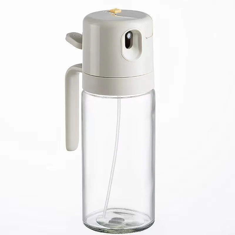 Warm grey 550ml glass oil sprayer bottle with dual-mode cap for spraying and pouring.
