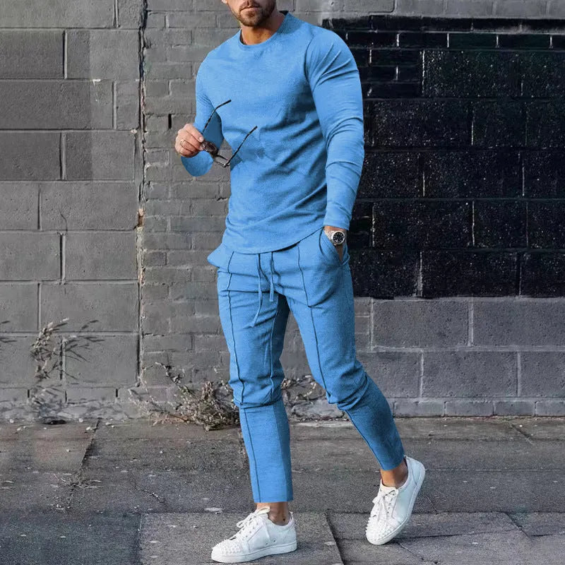 Men's light grey polyester two-piece suit set with long sleeve round neck T-shirt and matching trousers.