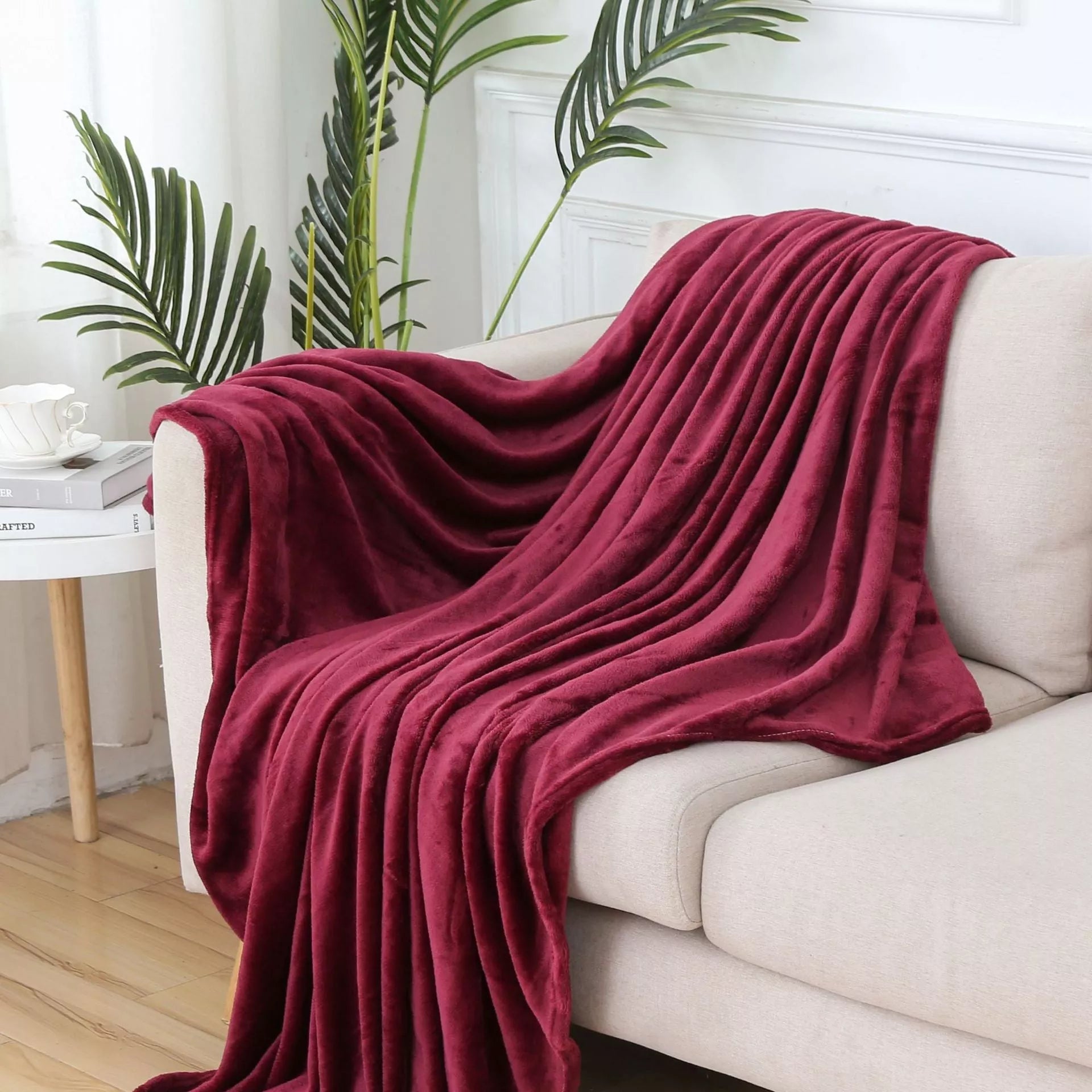 Solid color flannel blanket in various sizes and colors, made from durable polyester fiber