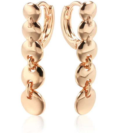 Gold finish hand-woven copper circle earrings showing textured surface and 5cm diameter