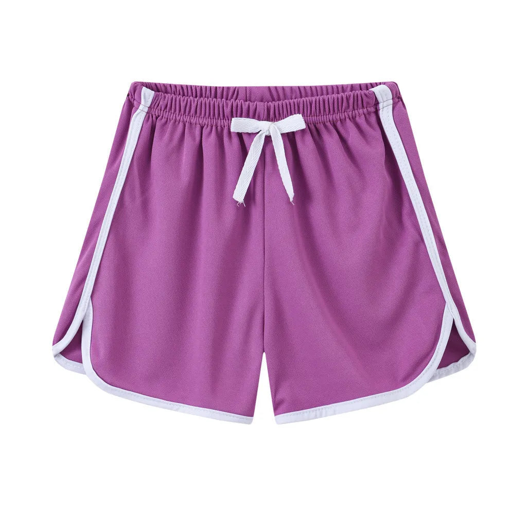 Children's polyester beach shorts in multiple colours and patterns, including leopard print and stripes, shown on size chart.