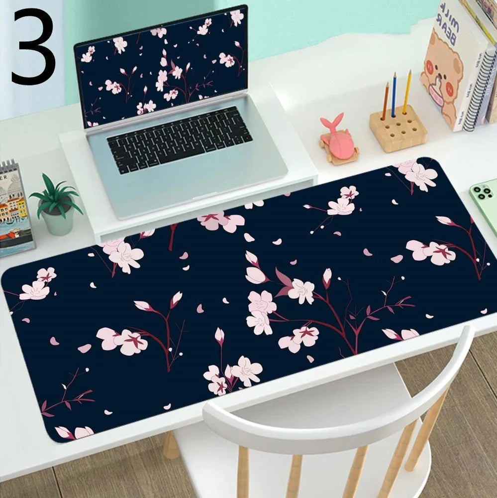 Large gaming mouse mat with printed design on rubber base, multiple size options from 300x600mm to 400x900mm