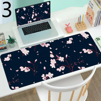 Large gaming mouse mat with printed design on rubber base, multiple size options from 300x600mm to 400x900mm