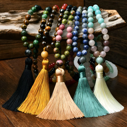 Long beaded necklace with geometric pendant and natural stone tassels in green aventurine.