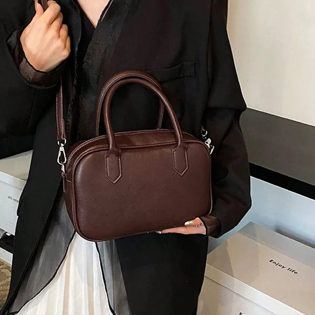Retro square PU leather messenger bag with an adjustable shoulder strap in black colour.