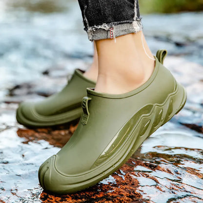 Men's short black plastic rain boots showing casual design and waterproof construction