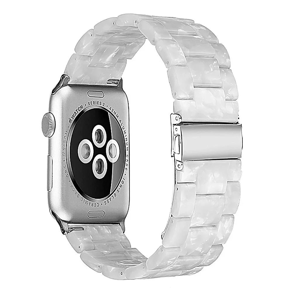 Slim resin Apple Watch strap showing attachment mechanism and colour options