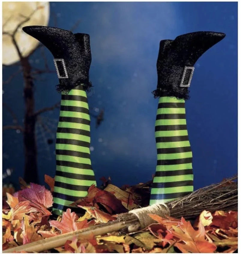 Halloween witch leg decoration with striped stockings and black boots