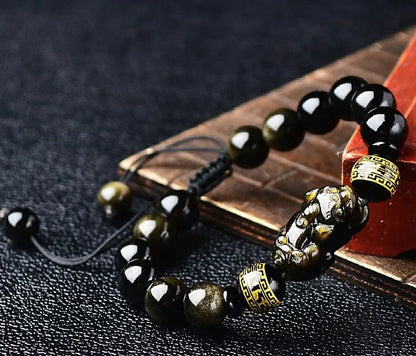 Hand-woven golden obsidian Pi Xiu bracelet with animal design, showing bead size options.