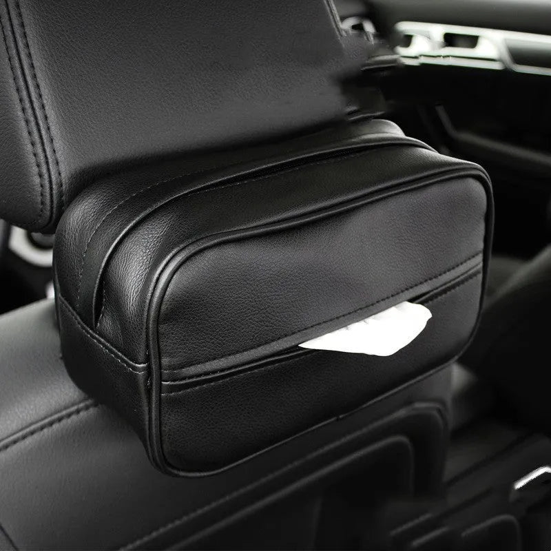 Black leather hanging storage box with PU coating, dimensions 23x13x9cm, shown behind a car headrest