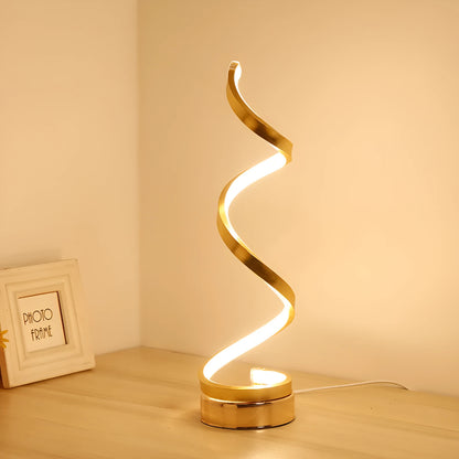 Black and white minimalist LED bedside lamp with aluminium shade and tri-colour dimming on a table