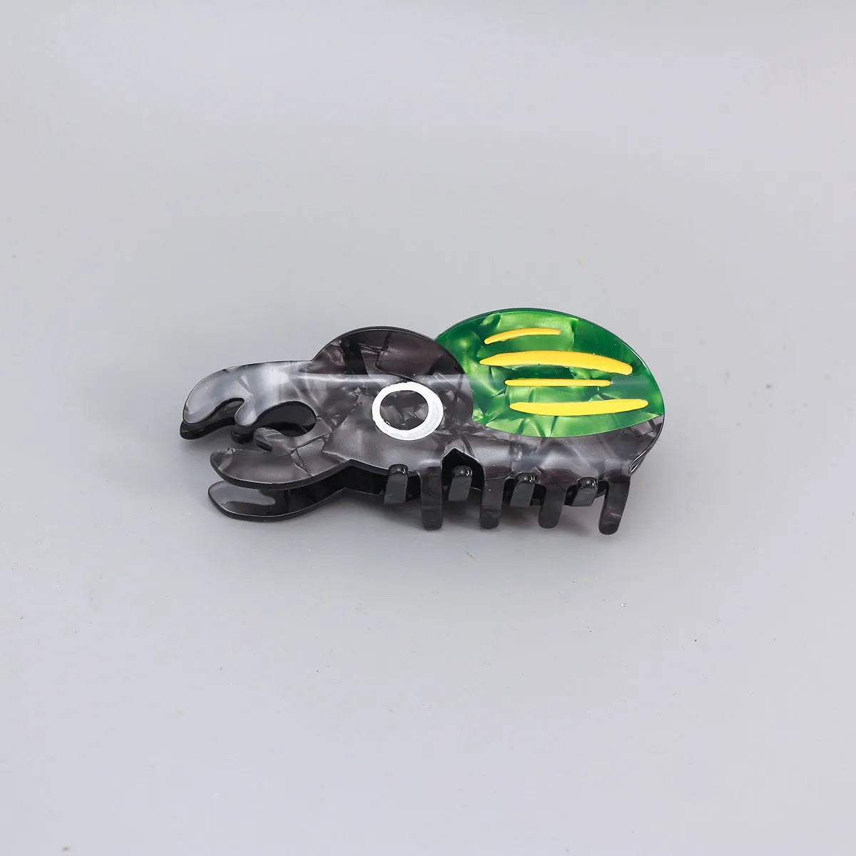 Handmade cartoon insect beetle grip hair clip or brooch in green, orange, or white designs.