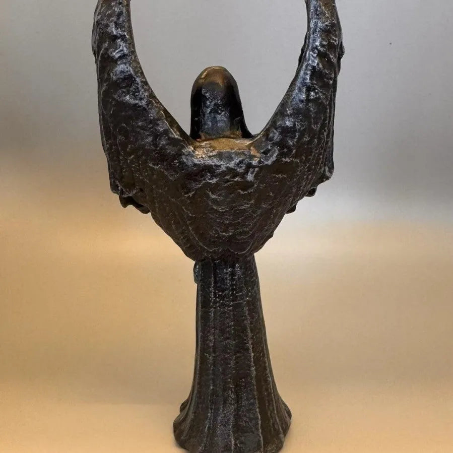 Dark Angel resin statue ornament measuring 6.5 by 5 by 17 centimetres on a wooden surface.