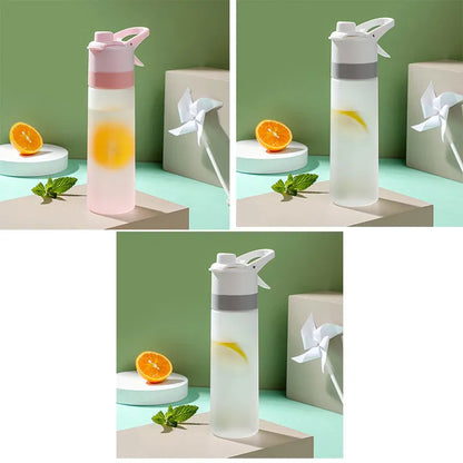 Large plastic spray water bottle with handle strap and leakproof lid in green colour.