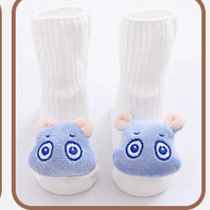 Cotton baby floor socks in assorted colours and patterns including bows, stars, and animal designs.