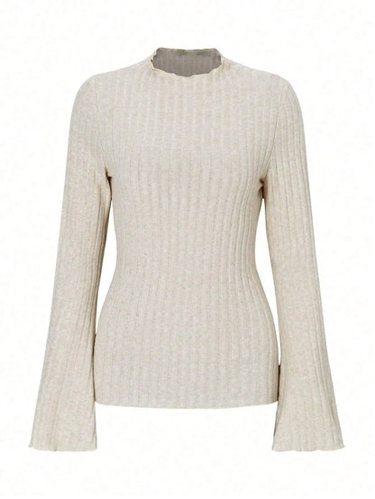 Long sleeve round neck top in black with lantern sleeves and slim fit, on a hanger