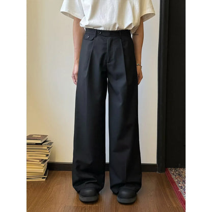 Men's straight-leg wide-fit casual trousers in brown, showing loose drape and straight cut from knee to ankle.