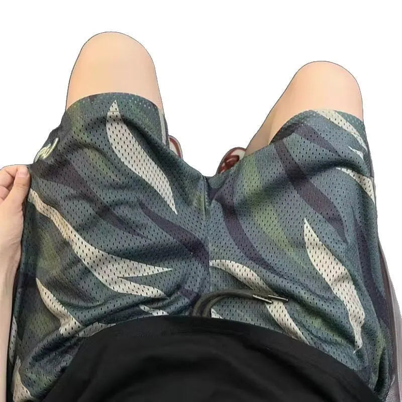Men's straight-leg camouflage shorts in a cotton-polyester blend fabric on a neutral background.