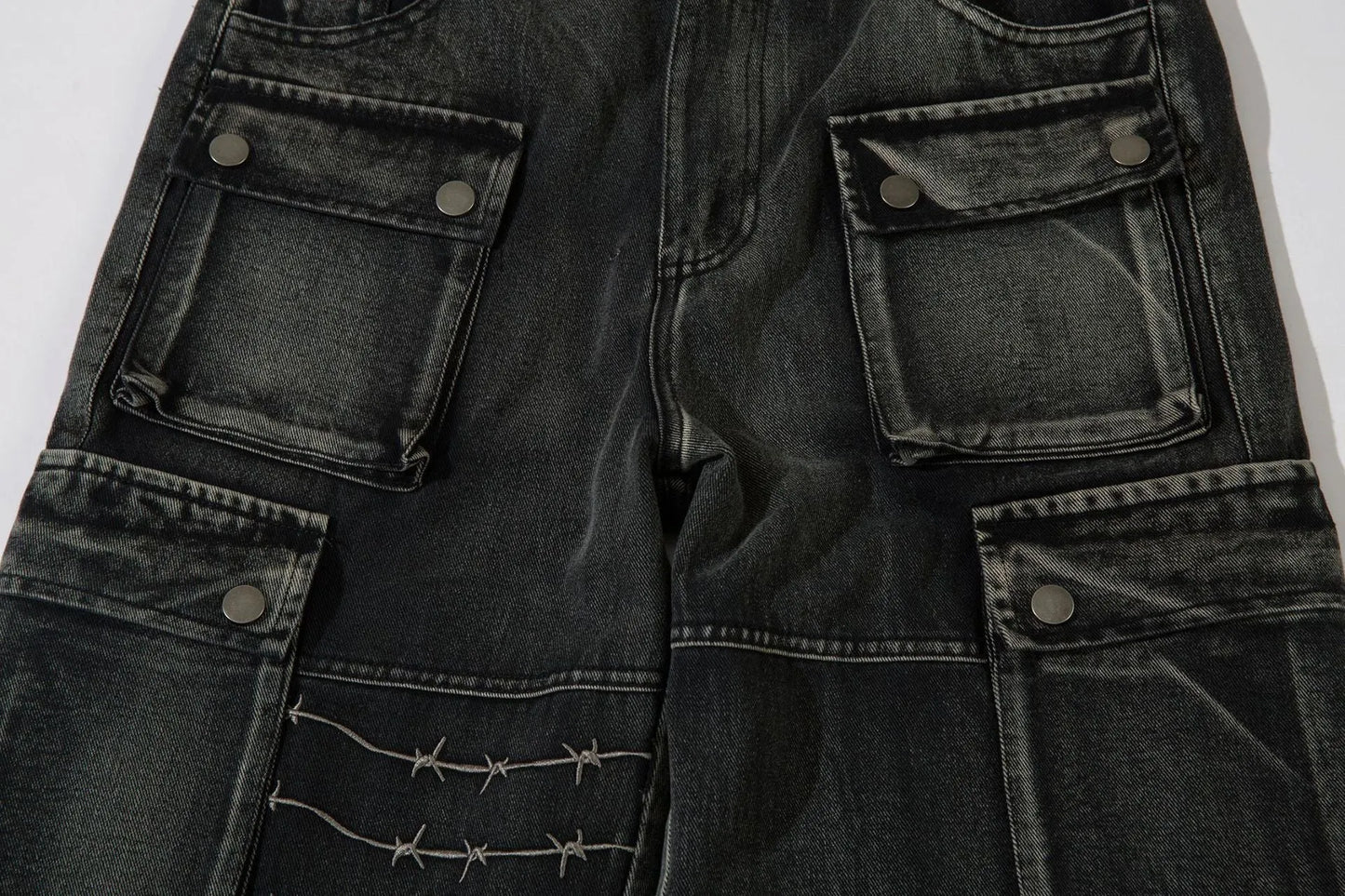 Men's black wide-leg cotton trousers with embroidery details on mid waist design