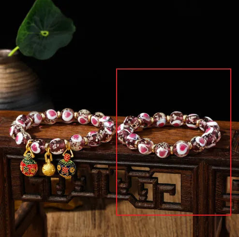 Handmade glass bracelet with 10mm swallowing gold beast cherry blossom heart charm in six colour options