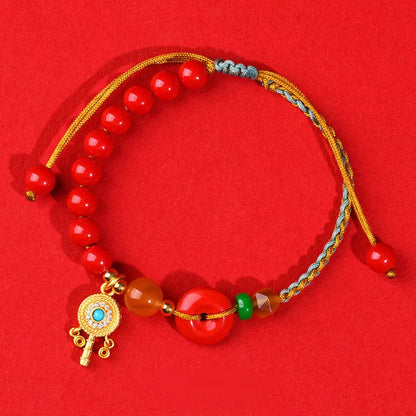 Hand-woven cinnabar peace blessing bracelet in emperor red sand with national style geometry design