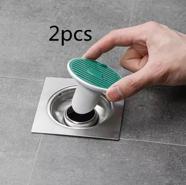 Whale Magnetic Suction Floor Drain Cover in white, orange, or green, blocking sewer odors with a tight seal