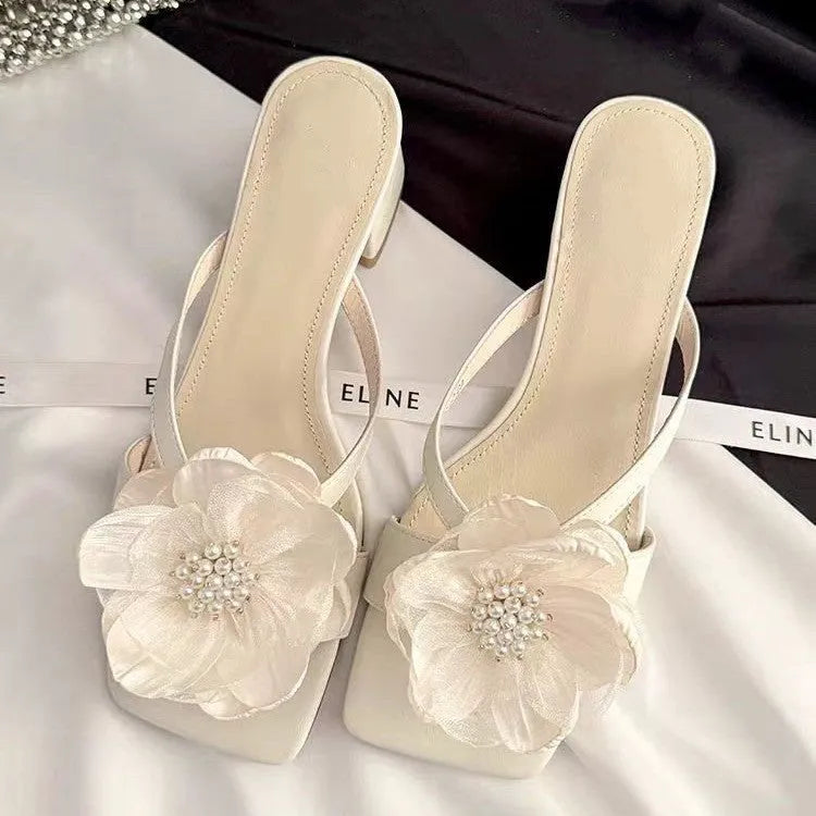 Women's chunky heel square toe sandals with satin upper in cream-white colour showing one-line strap design