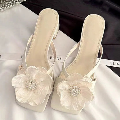 Women's chunky heel square toe sandals with satin upper in cream-white colour showing one-line strap design