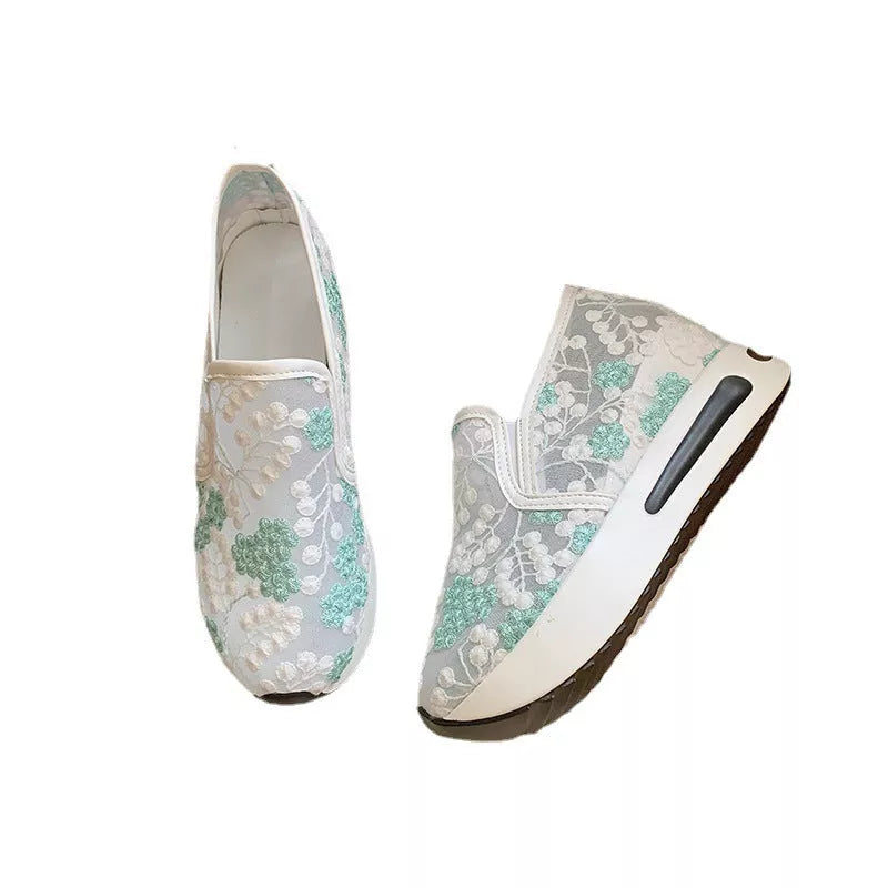 Women's lace mesh high heel sneakers in green and pink with slope heel design