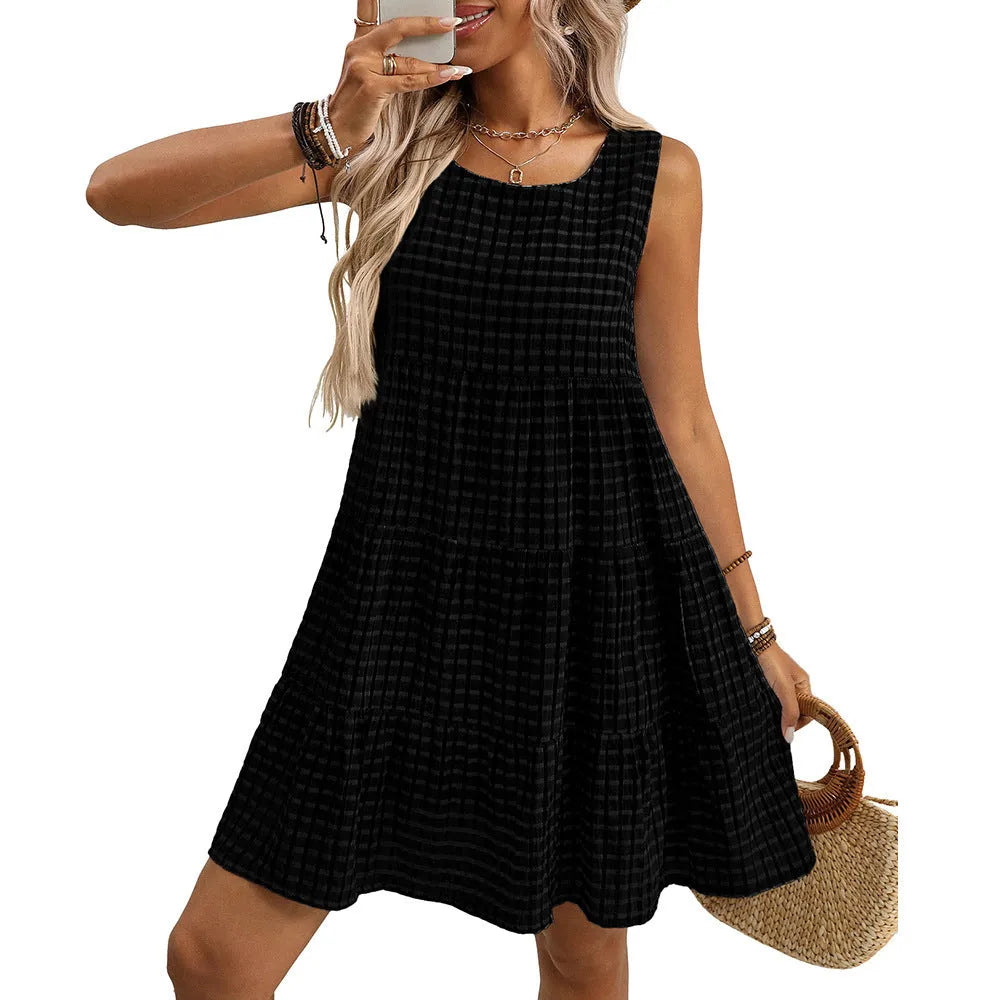 Women's light blue sleeveless plaid dress with a high waist and flowing swing skirt.
