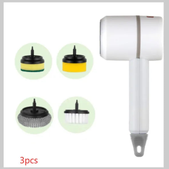 Green electric cleaning brush with scouring pad and brush heads on a kitchen worktop.