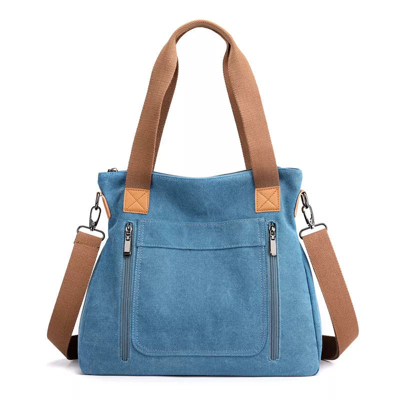 Women's canvas shoulder bag in various colors with large capacity and zipper closure