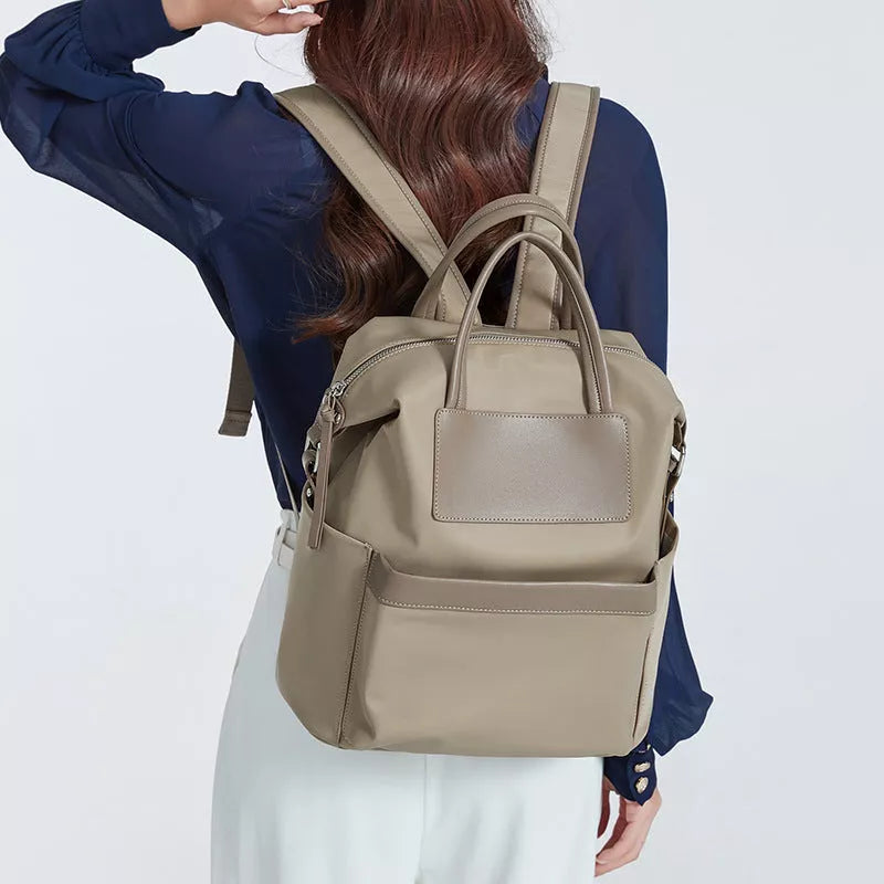 Women's lightweight waterproof backpack with hand-hold design in khaki and black