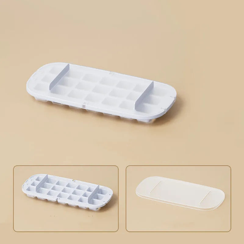 Yellow and blue food grade plastic ice cube trays with ice shovel stored in dedicated slot