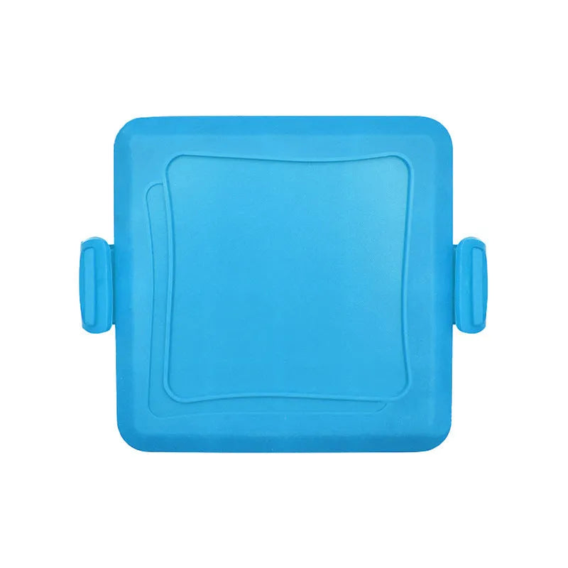 Red silicone baking tray with handbag-shaped mould and matching heat-resistant gloves on kitchen counter